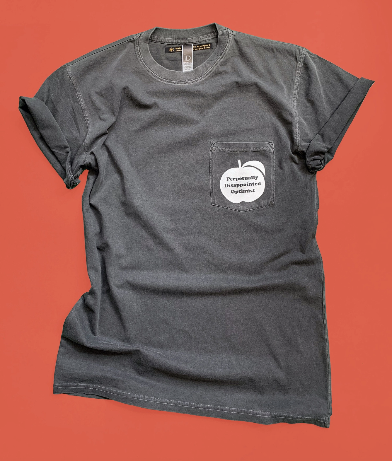 Perpetually Disappointed Optimist Pocket Unisex Tee