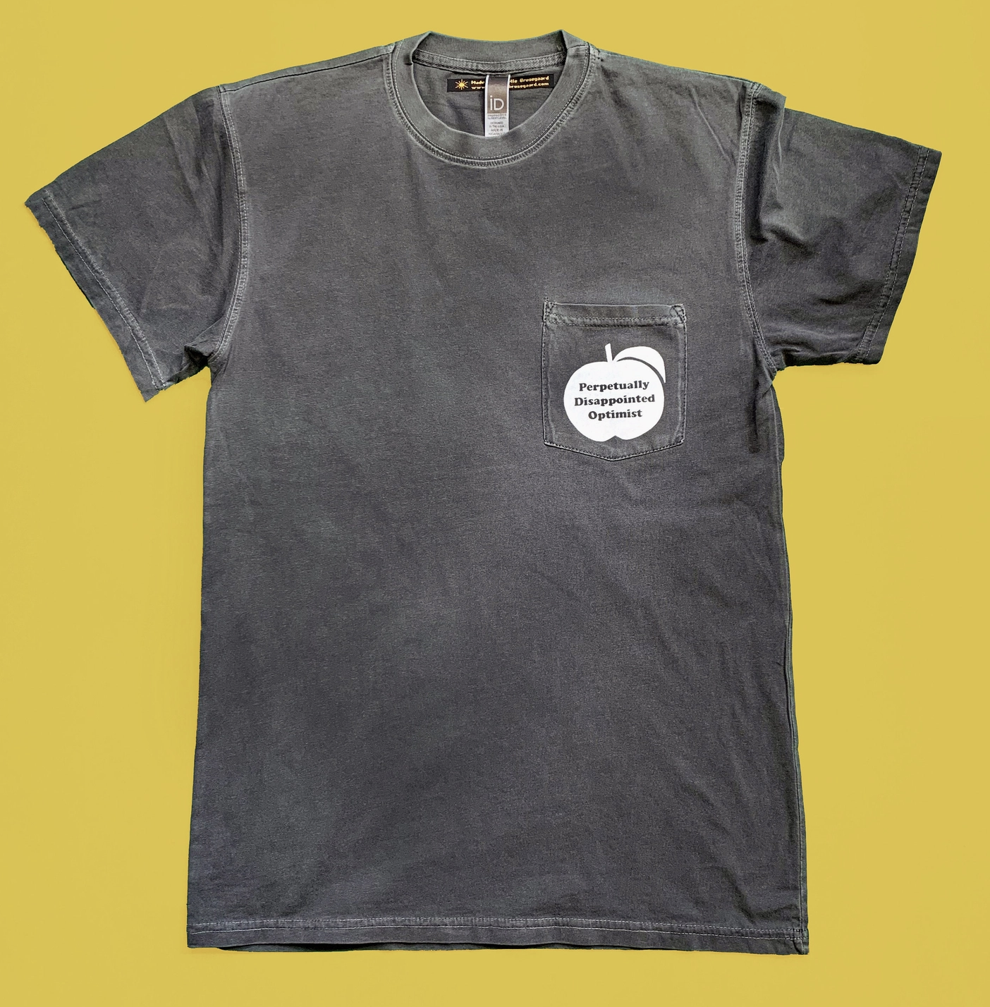 Perpetually Disappointed Optimist Pocket Unisex Tee