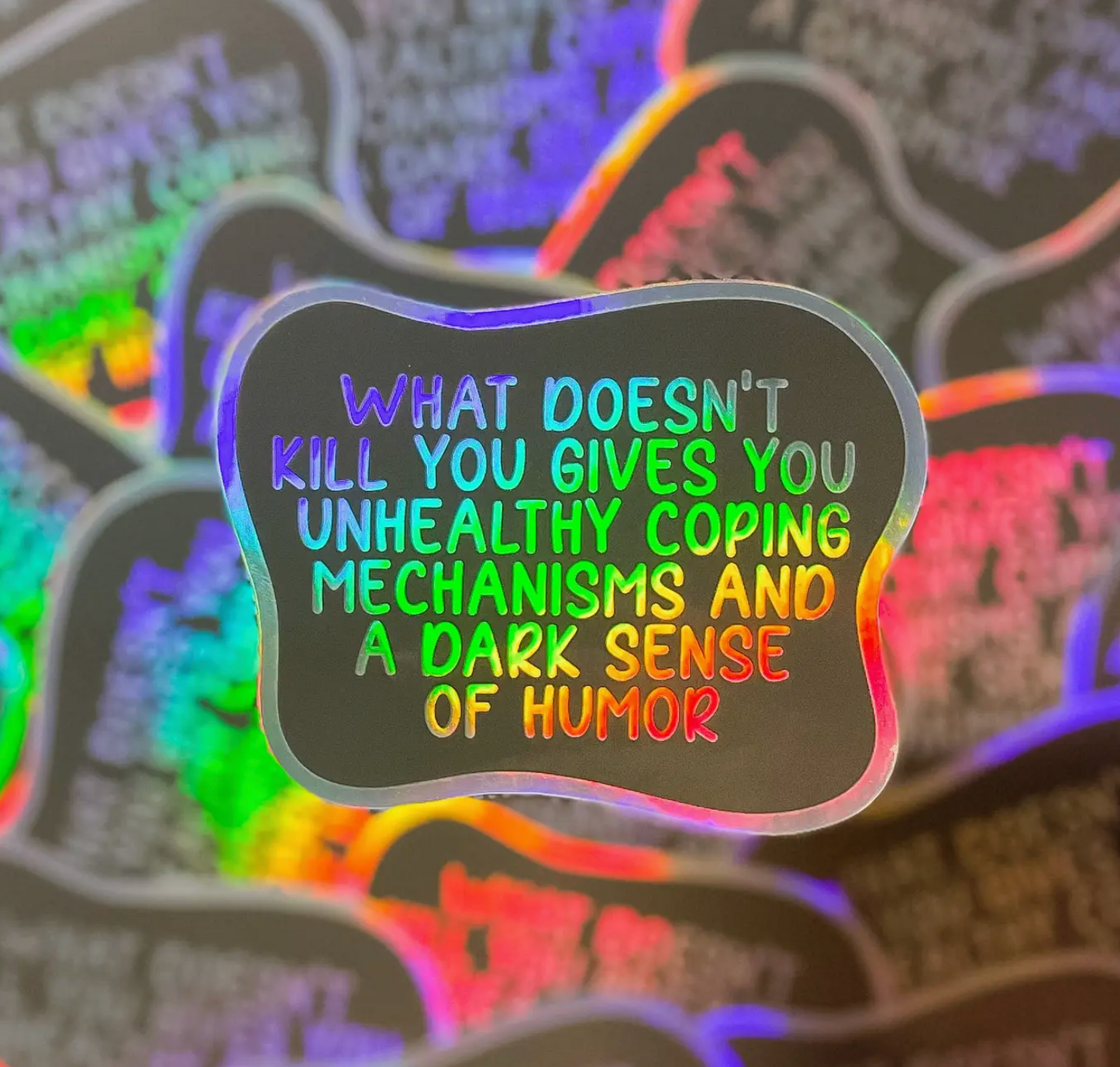 What Doesn't Kill You Gives You Unhealthy Coping Mechanisms And a Dark Sense Of Humor Holographic Sticker